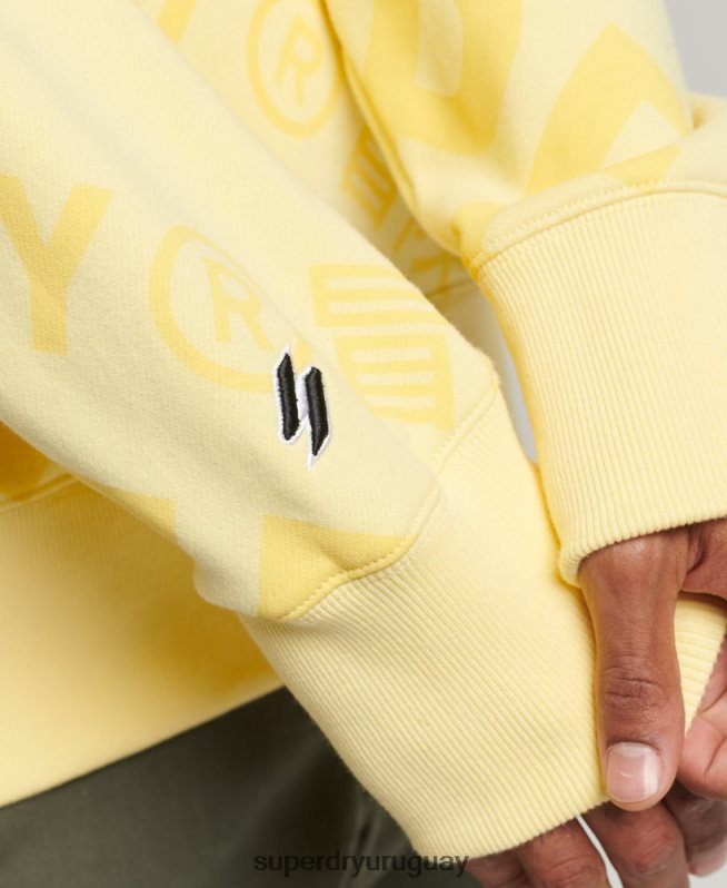 uy Superdry hombres sudadera con estampado de logo central en toda la prenda amarillo DT2N8Z3435 ropa