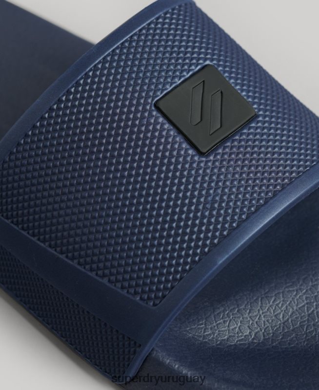 uy Superdry hombres controles deslizantes de tecnología de código azul DT2N8Z99 zapatos